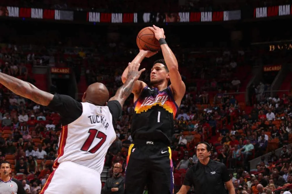 Booker stars as Suns beat Heat to seal NBA playoff berth