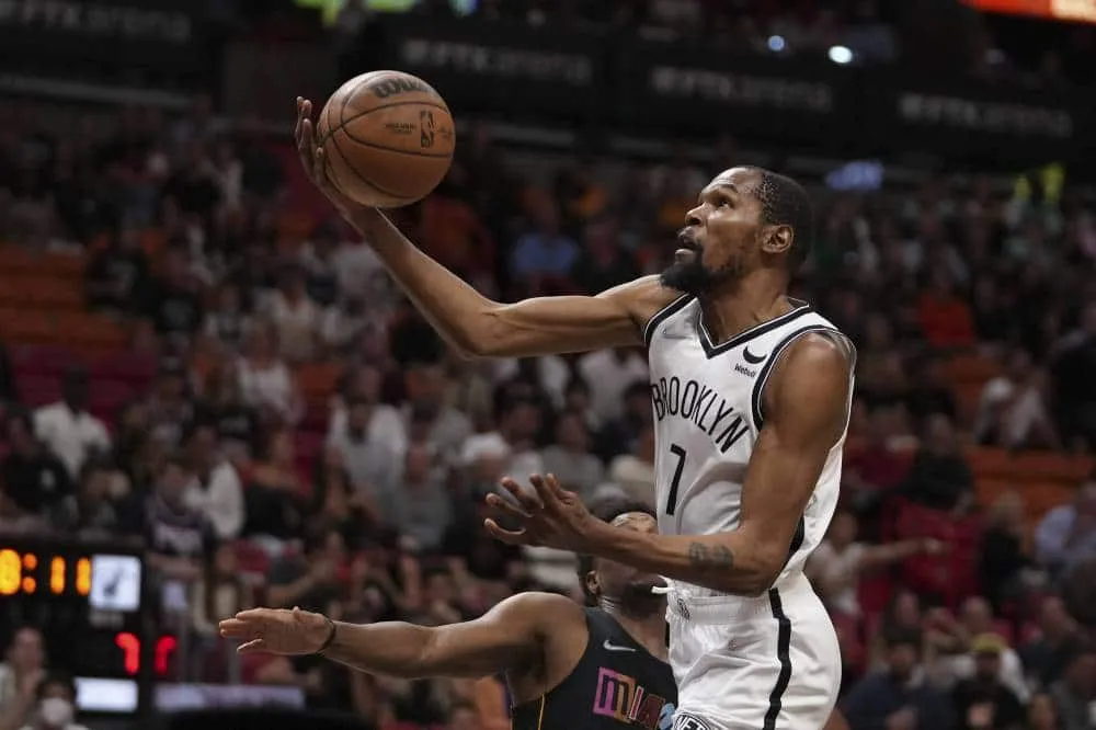 Nets cool sputtering Heat as Sixers seize NBA East lead